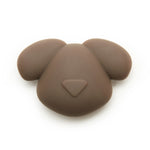 Kikkerland Kobe Air Tag Holder, a brown silicone dog-face shaped AirTag case