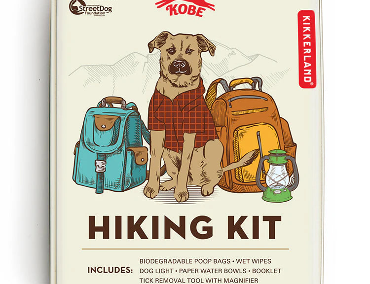 Kikkerland Kobe Hiking Kit tin with an illustrated dog in a plaid shirt beside backpacks