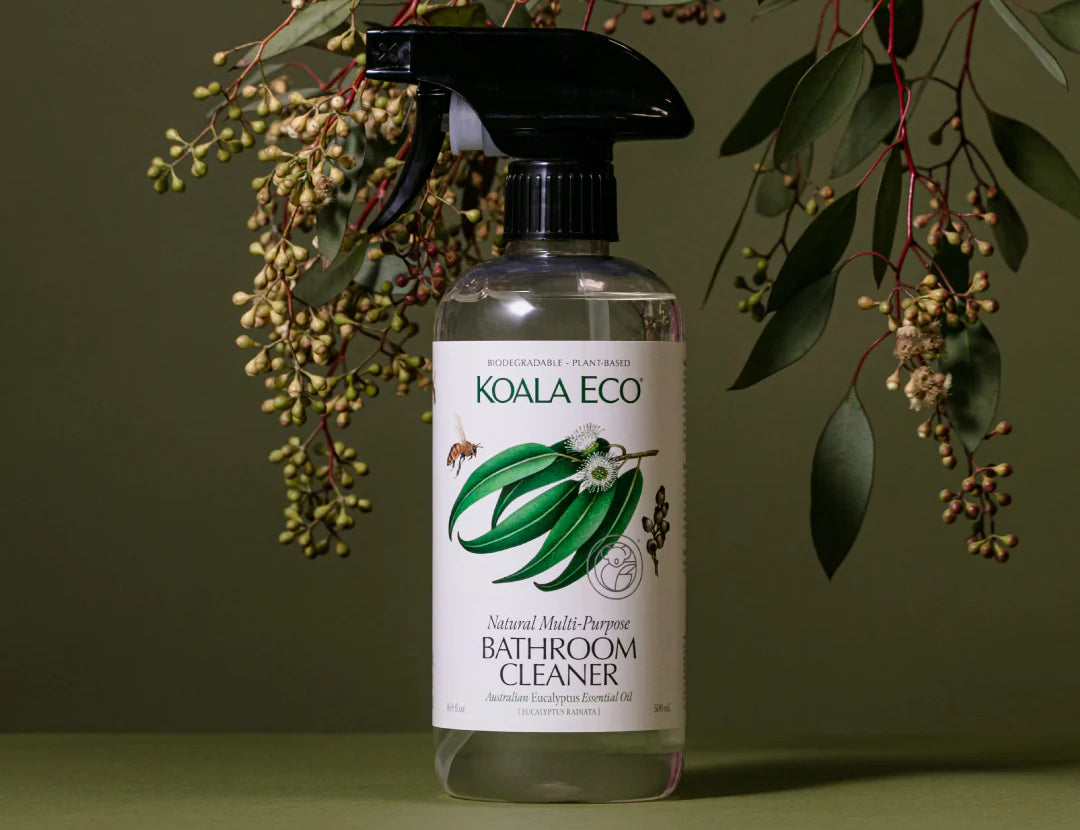 Koala Eco Natural Multi-Purpose Bathroom Cleaner bottle under eucalyptus branches on a green background
