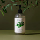 Koala Eco Natural Hand Wash bottle under eucalyptus branches on a green background