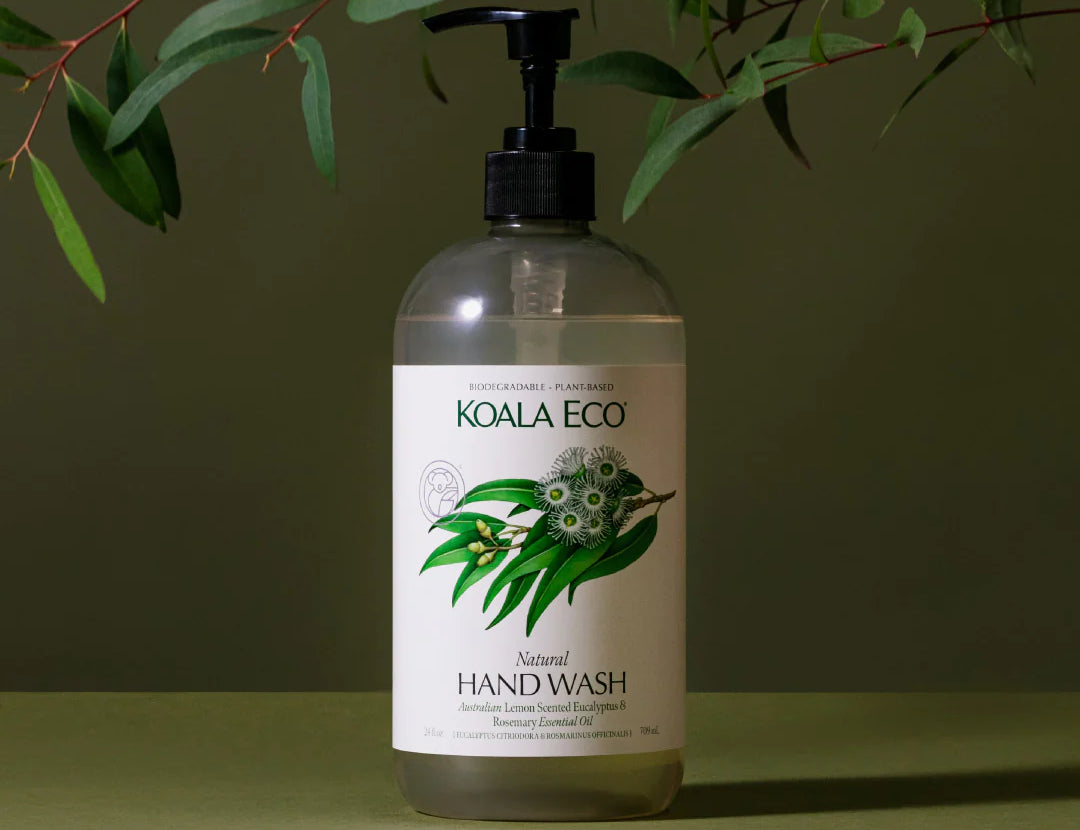 Koala Eco Natural Hand Wash bottle under eucalyptus branches on a green background