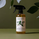 Koala Eco Natural Multi-Purpose Kitchen Cleaner bottle under green leaves on a green background