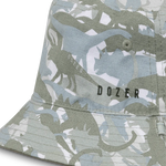 Close-up of the green dinosaur camo print and Dozer logo on the Kooringal Boys Bucket Hat in Clifton Camo