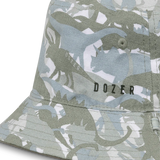 Close-up of the green dinosaur camo print and Dozer logo on the Kooringal Boys Bucket Hat in Clifton Camo