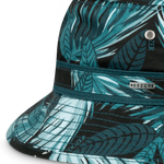 Close-up of the teal palm leaf print, eyelet and Dozer tag on the Kooringal Boys Bucket Hat in Hideaway