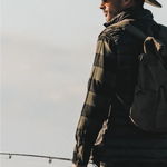 Man in a plaid jacket wearing the Kooringal Nomad Cowboy Hat in Sand outdoors