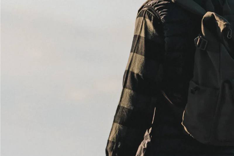 Man in a plaid jacket wearing the Kooringal Nomad Cowboy Hat in Sand outdoors