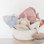 Lambwolf Collective Angel Fish Dog Toys in pink and light blue in a rope basket with other plush toys