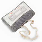 Lambwolf Collective Cassette Dog Toy, a gray tweed cassette tape plush with a pull-out cream ribbon