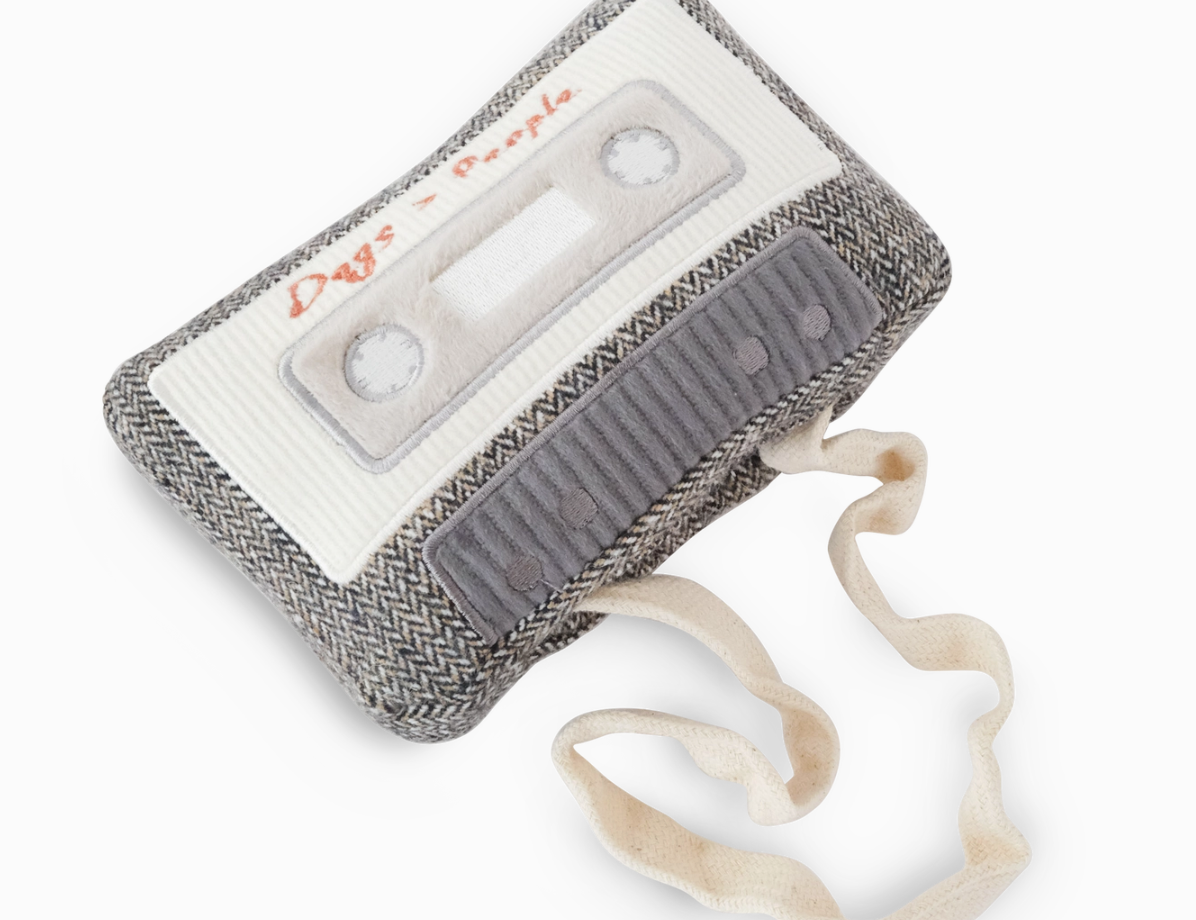 Lambwolf Collective Cassette Dog Toy, a gray tweed cassette tape plush with a pull-out cream ribbon