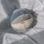 Lambwolf Collective Toto Enrichment Dog Toy in Marine resting on gray bedding