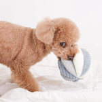 Apricot poodle carrying the Lambwolf Collective Toto Enrichment Dog Toy in Marine, close-up