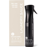 Laundry Sauce Fabric Refresher Spray in Himalayan Cashmere, a black spray bottle beside its cream box