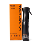 Laundry Sauce Fabric Refresher Spray in Italian Bergamot, a black spray bottle beside its orange box
