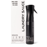 Laundry Sauce Fabric Refresher Spray in Siberian Pine, a black spray bottle beside its white box