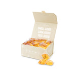 Laundry Sauce Laundry Detergent Pods in Himalayan Cashmere, an open cream box of amber pods