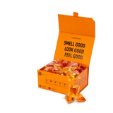 Laundry Sauce Laundry Detergent Pods in Italian Bergamot, an open orange box of amber pods