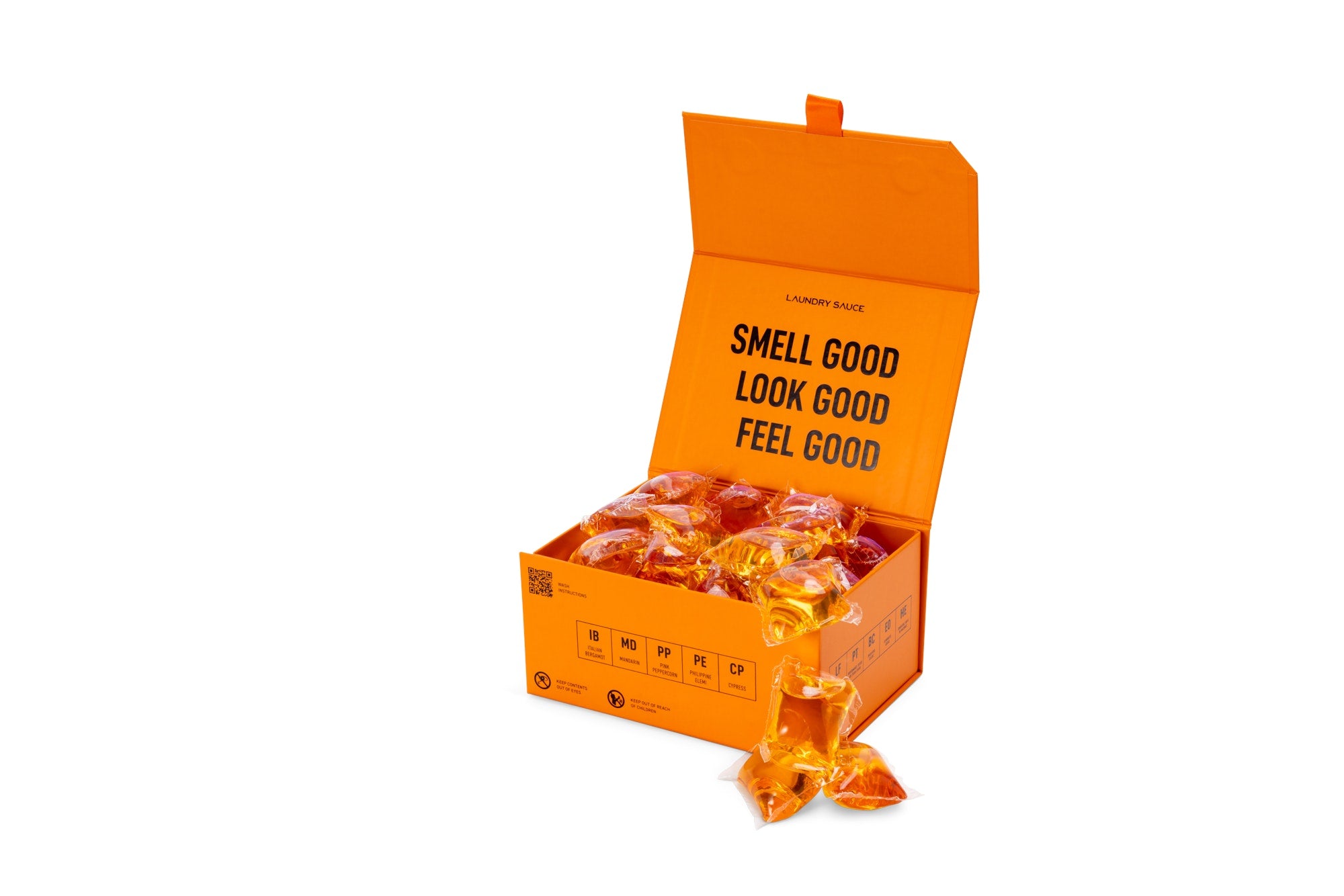 Laundry Sauce Laundry Detergent Pods in Italian Bergamot, an open orange box of amber pods