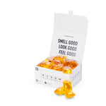 Laundry Sauce Laundry Detergent Pods in Siberian Pine, an open white box of amber pods