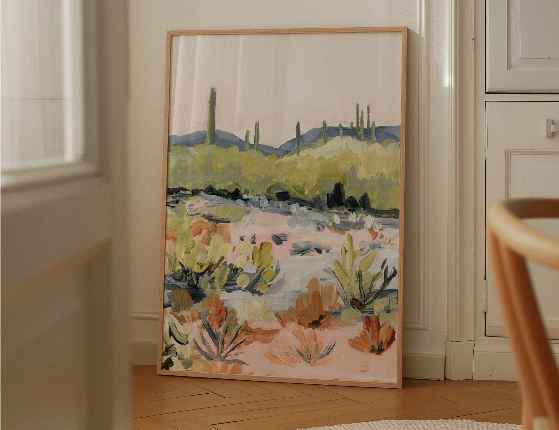 Laurie Anne Art Bright Desert Fine Art Print in a thin gold frame leaning against a wall in a sunlit room