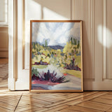Laurie Anne Art Brush Desert Fine Art Print in a thin gold frame leaning against a wall on a wood floor