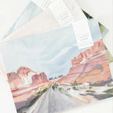 Laurie Anne Art Canyon Road Fine Art Prints fanned out with Laurie Anne tags