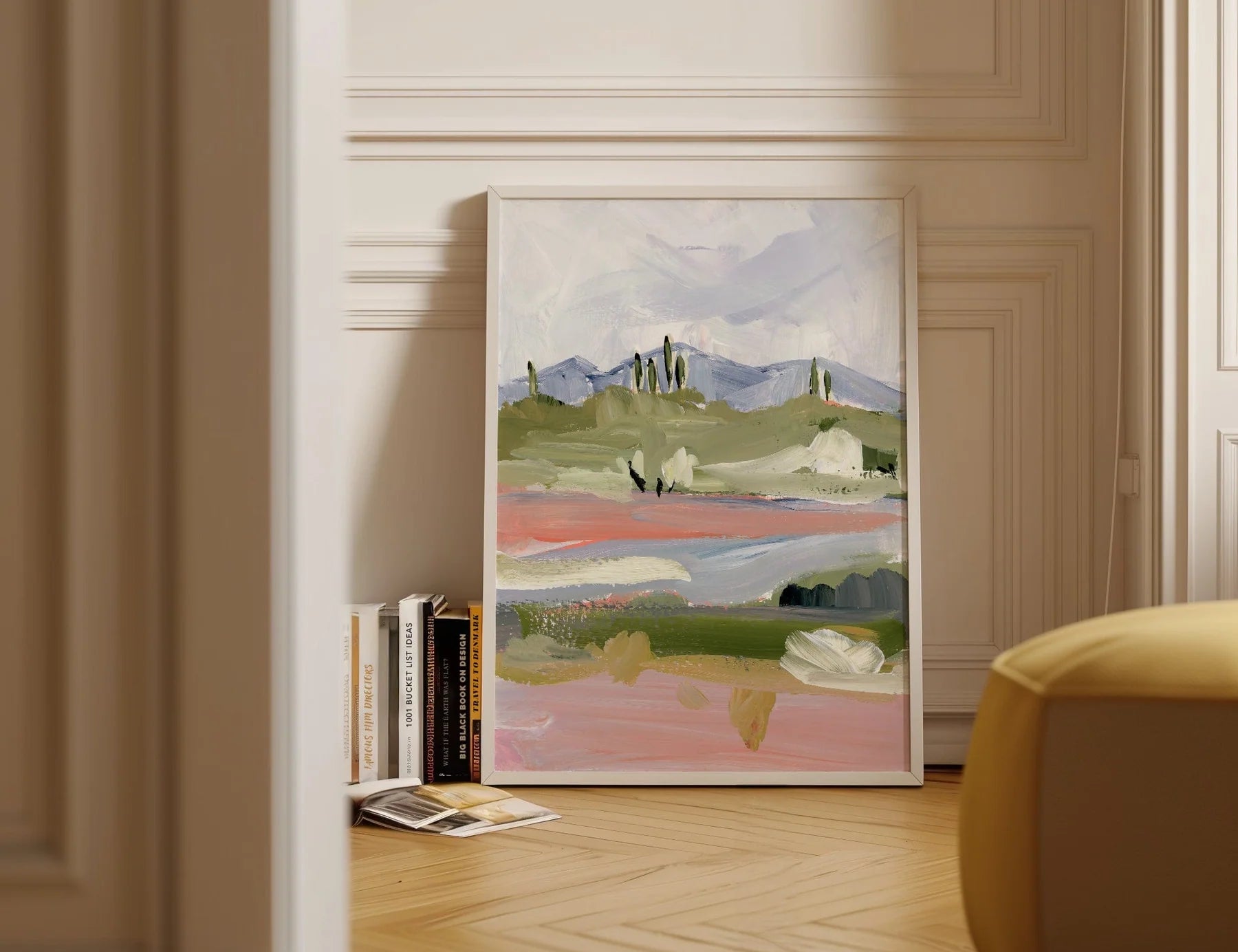 Laurie Anne Art Periwinkle Desert Fine Art Print in a wood frame leaning against a wall in a sunlit room
