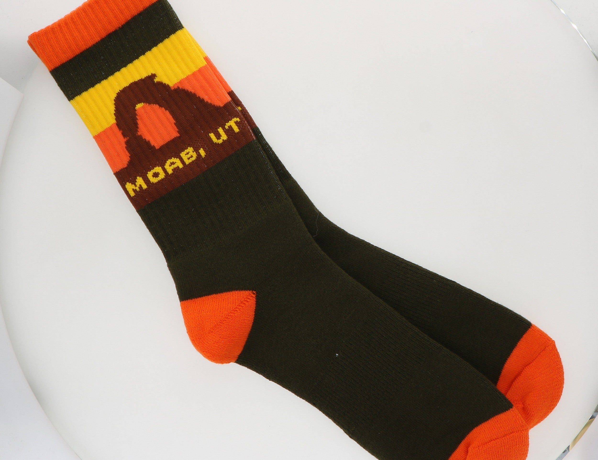 Locale Moab Arches Dark Green Socks, dark green crew socks with an arch sunset cuff and orange trim