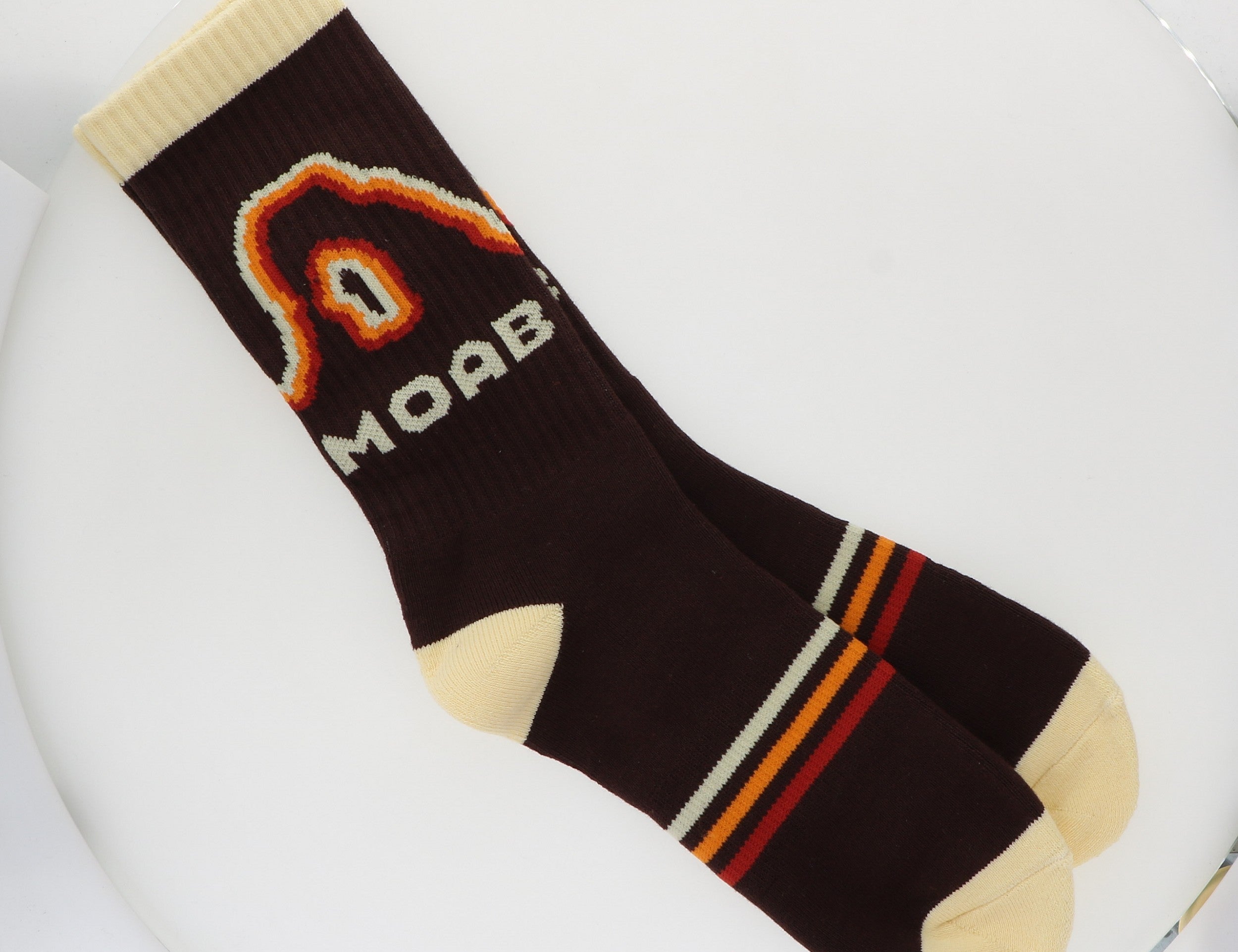 Locale Retro Moab Socks, black crew socks with an orange retro arch design reading Moab and striped cuffs