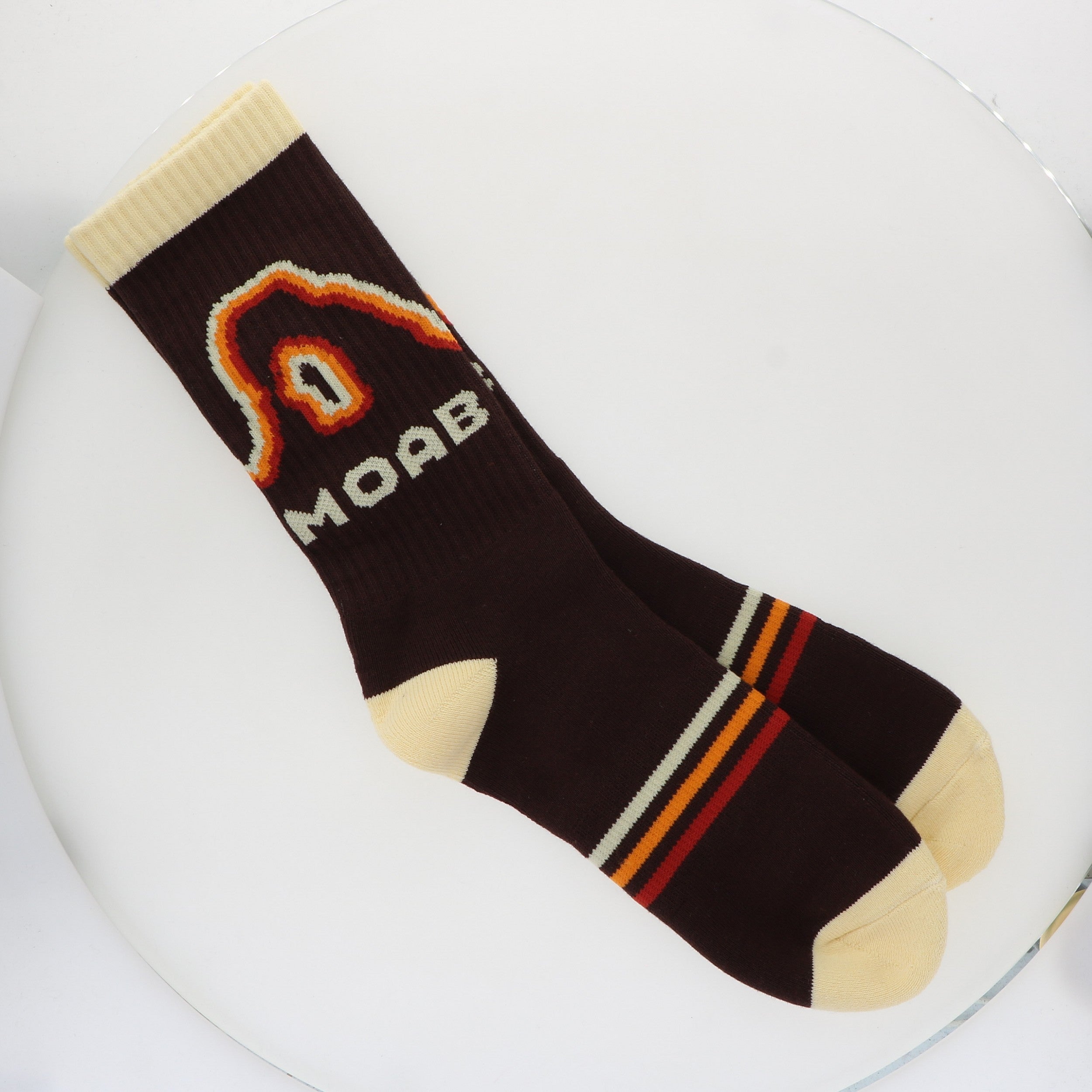 Locale Retro Moab Socks, black crew socks with an orange retro arch design reading Moab and striped cuffs