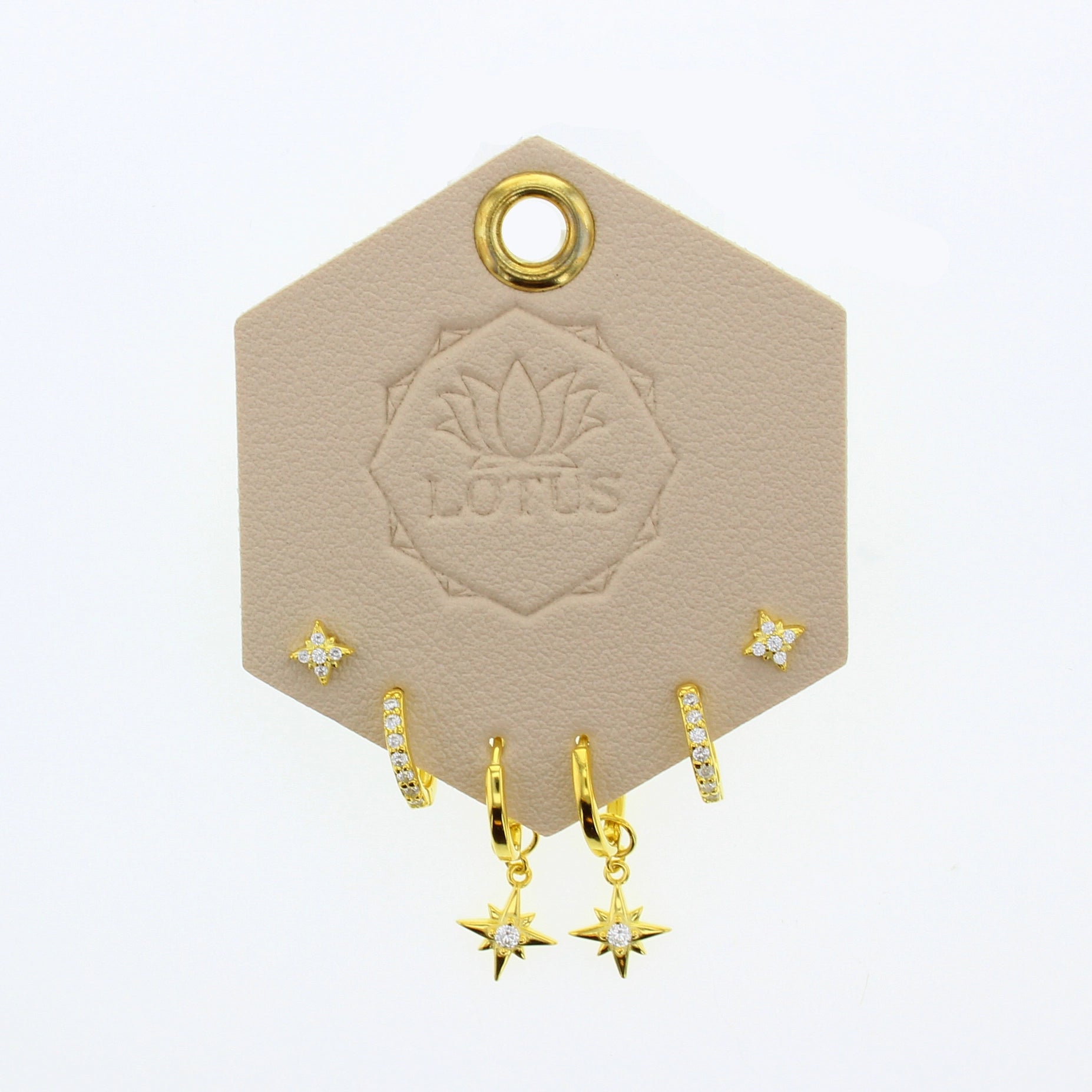 Lotus Studio Gold Trio Earrings in Amelia, star studs, pave huggies and star drop hoops on a Lotus card