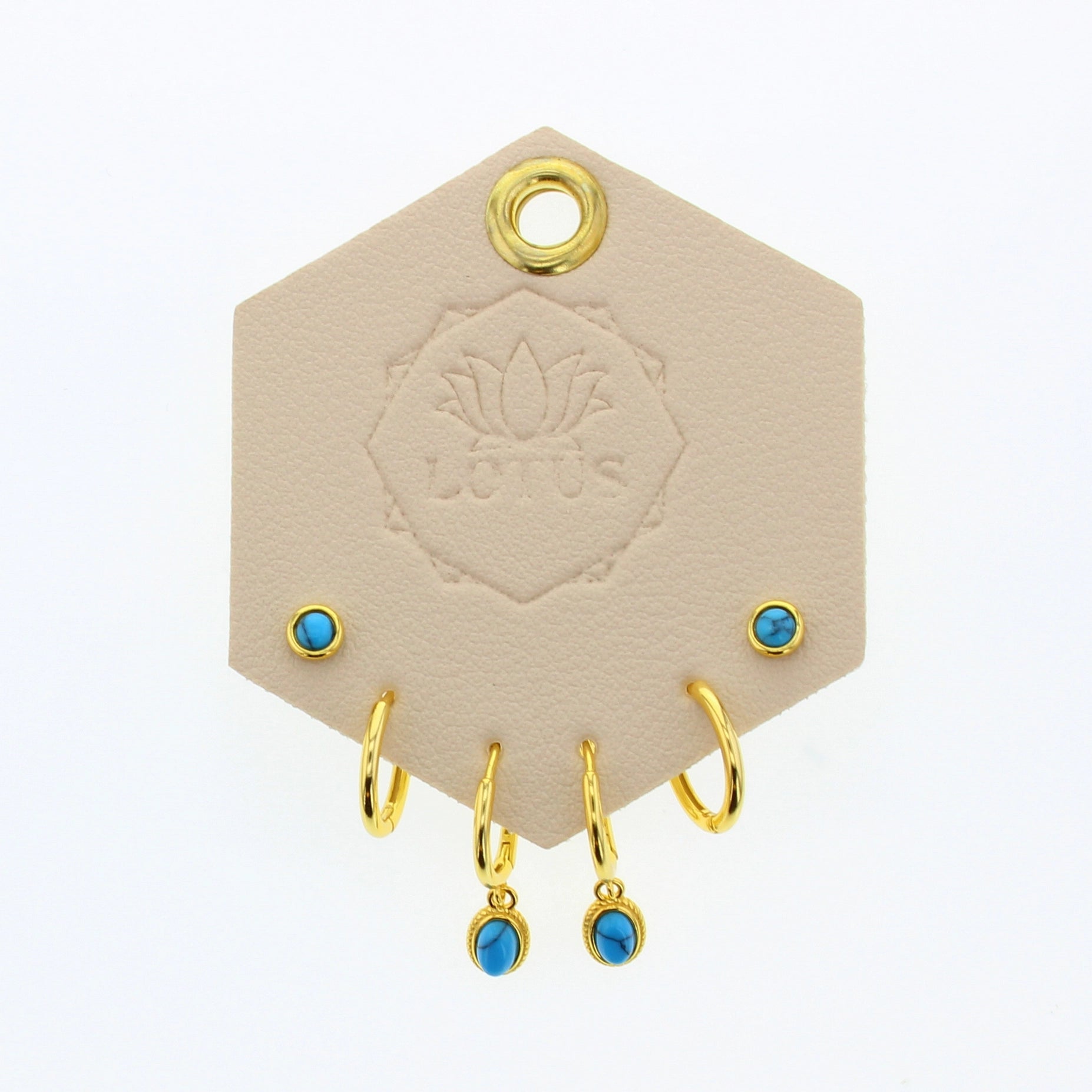 Lotus Studio Gold Trio Earrings in Andy, turquoise studs, gold huggies and turquoise drop hoops on a Lotus card