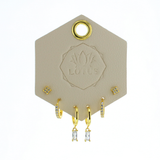 Lotus Studio Gold Trio Earrings in Camila, flower studs, pave huggies and baguette drop hoops on a Lotus card
