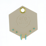 Lotus Studio Gold Trio Earrings in Eva, turquoise flower studs, star studs and turquoise huggies on a Lotus card