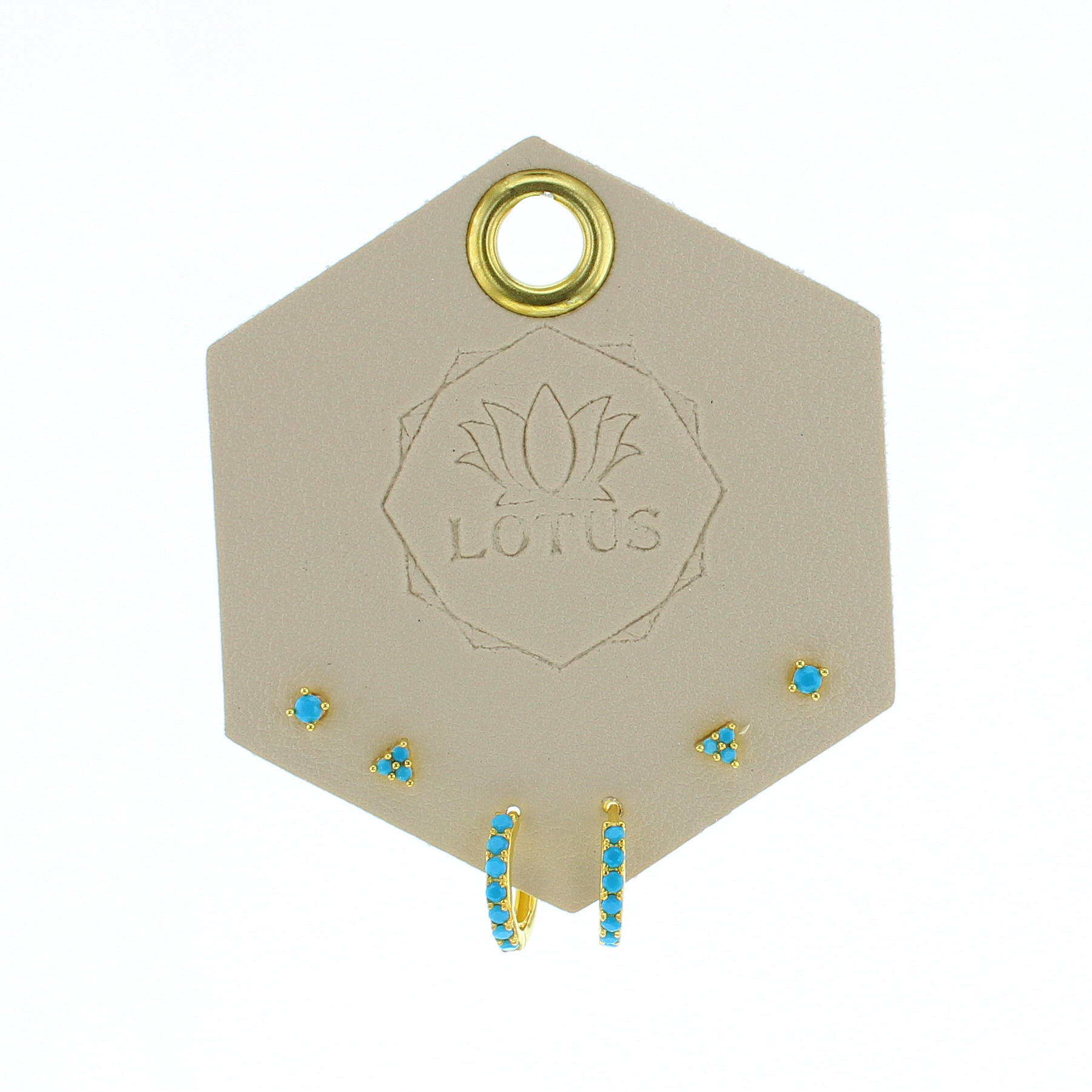 Lotus Studio Gold Trio Earrings in Eva, turquoise flower studs, star studs and turquoise huggies on a Lotus card