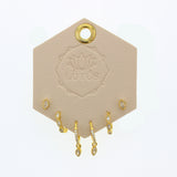Lotus Studio Gold Trio Earrings in Evelyn, crystal studs, pave huggies and teardrop hoops on a Lotus card