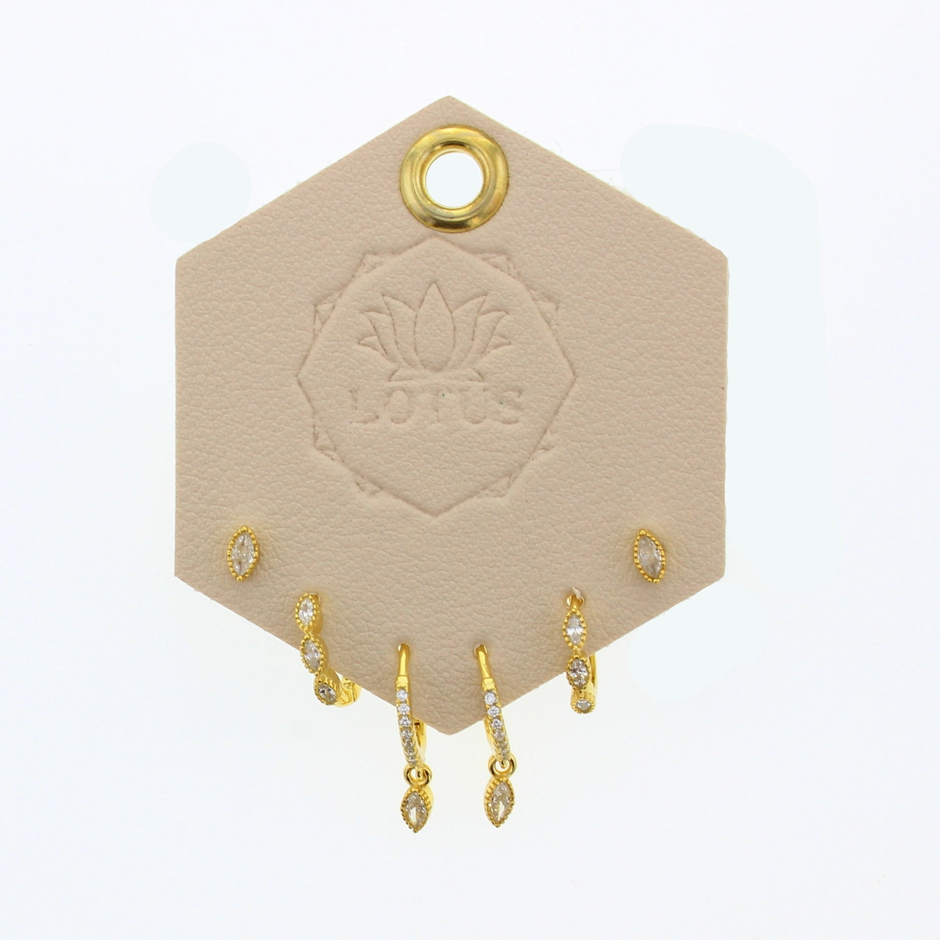 Lotus Studio Gold Trio Earrings in Evelyn, crystal studs, pave huggies and teardrop hoops on a Lotus card