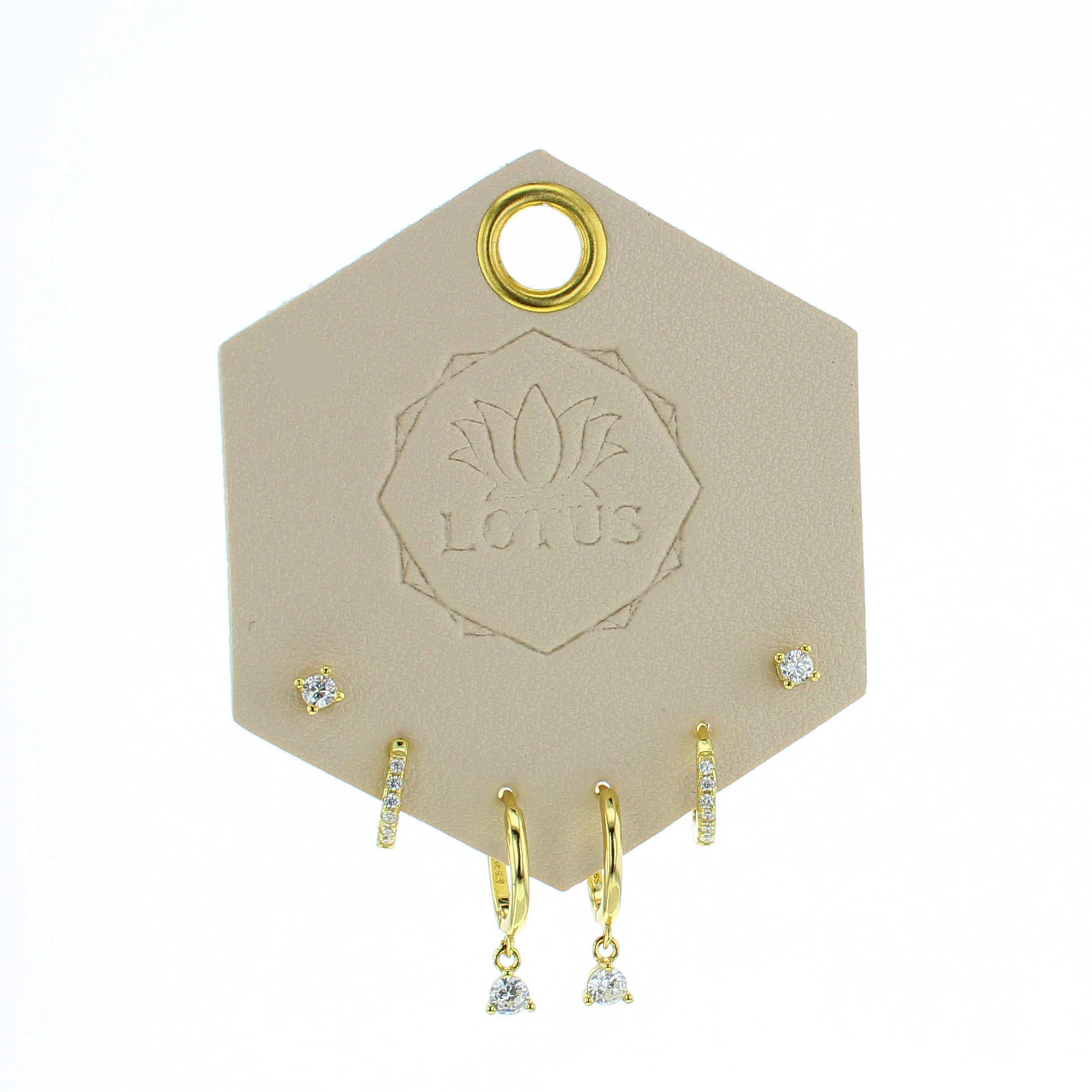 Lotus Studio Gold Trio Earrings in Lucy, crystal studs, huggies and teardrop crystal hoops on a Lotus card