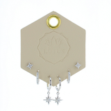 Lotus Studio Silver Trio Earrings in Amelia, star studs, pave huggies and star drop hoops on a Lotus card