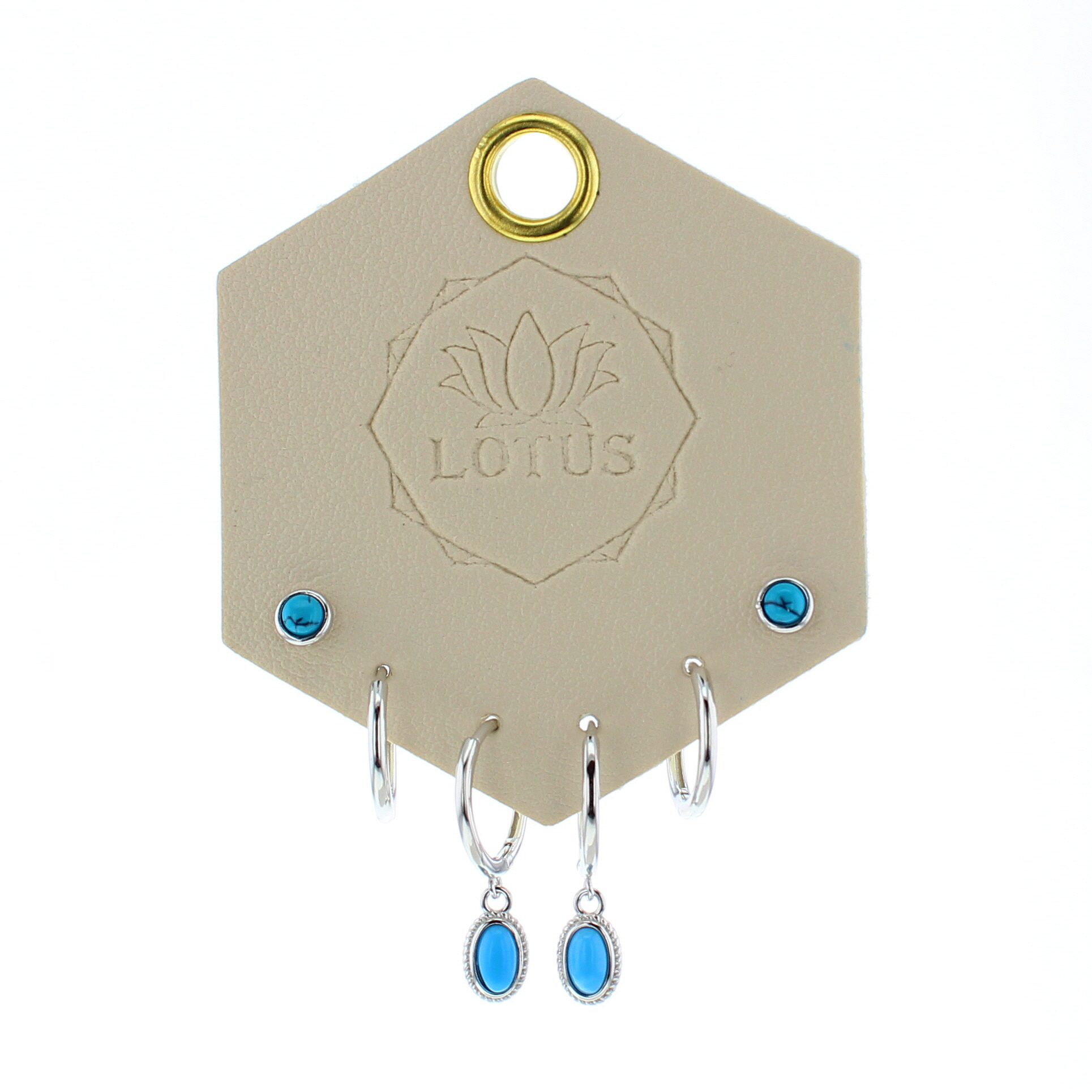 Lotus Studio Silver Trio Earrings in Andy, turquoise studs, silver huggies and turquoise drop hoops on a Lotus card