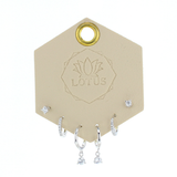 Lotus Studio Silver Trio Earrings in Lucy, crystal studs, huggies and teardrop crystal hoops on a Lotus card