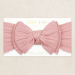 Lou Lou & Company Cable Knit Headband in Rose, a dusty pink bow headband on its card