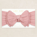 Lou Lou & Company Cable Knit Headband in Rose, a dusty pink bow headband on its card