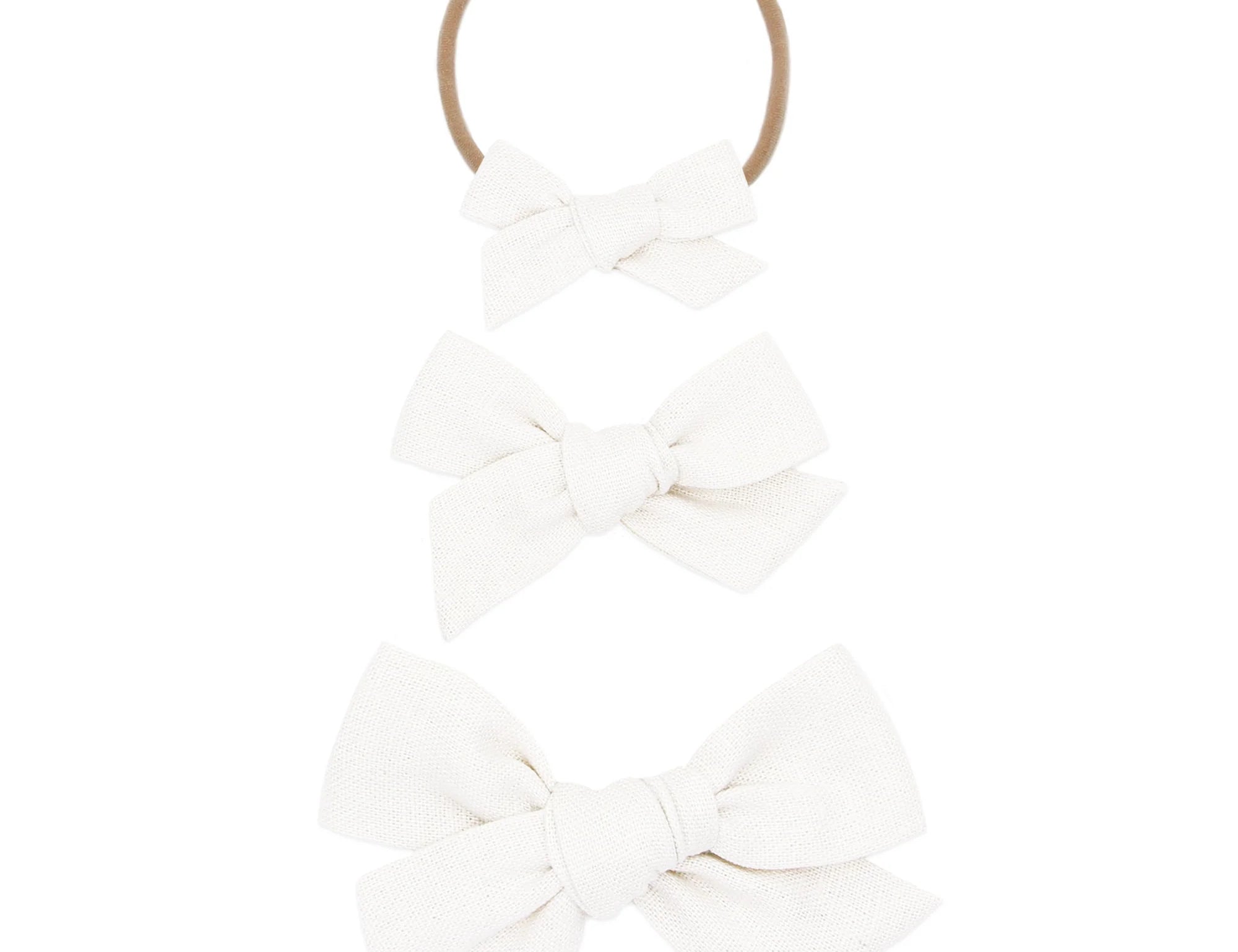 Lou Lou & Company Classic Bow in White, shown as a nylon headband and two clip bows