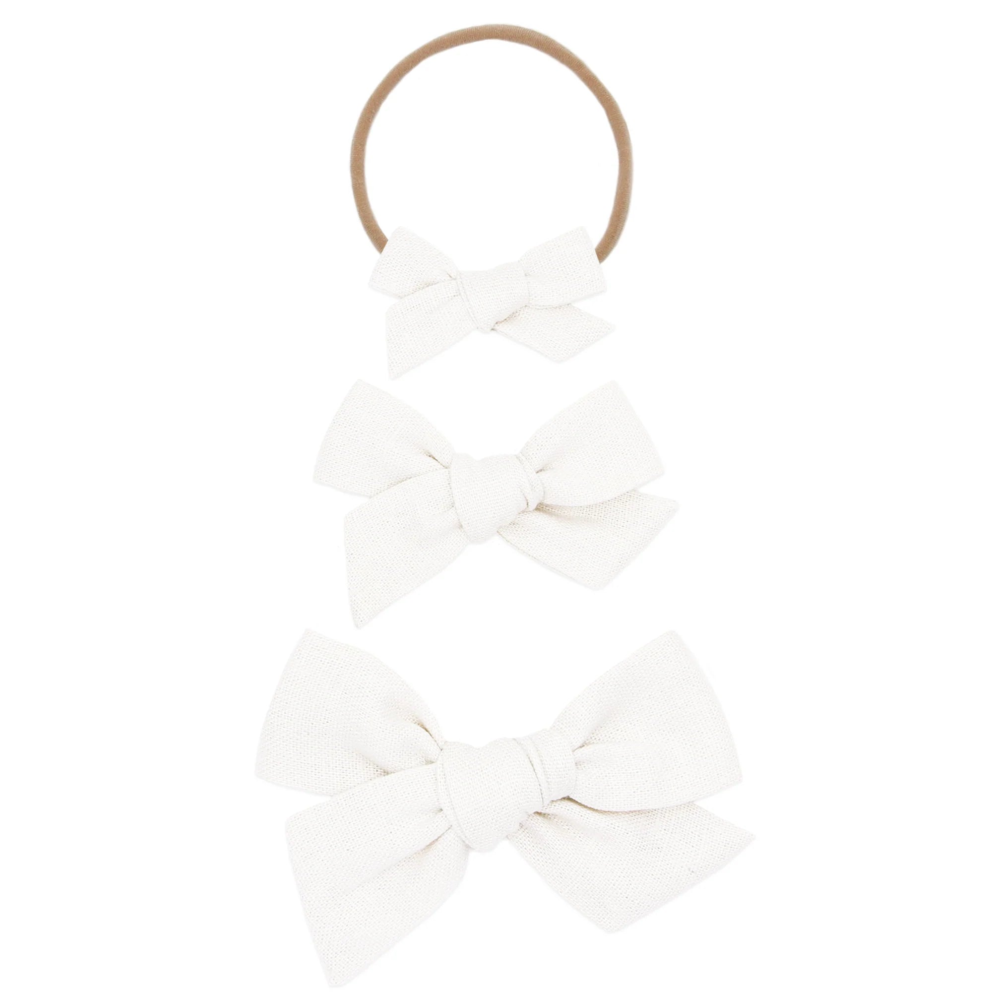 Lou Lou & Company Classic Bow in White, shown as a nylon headband and two clip bows