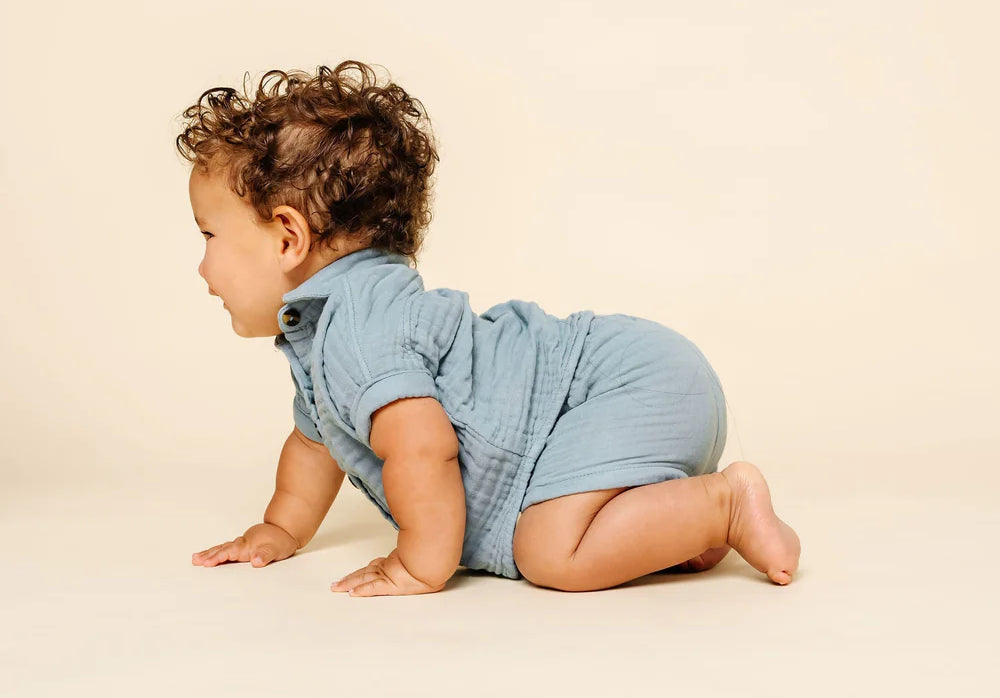 Baby crawling in the Lou Lou & Company Cloud Muslin Shirt and Shorts in Steel