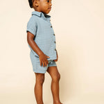 Toddler in profile wearing the Lou Lou & Company Cloud Muslin Shirt and Shorts in Steel