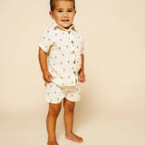 Toddler standing in the Lou Lou & Company Cloud Muslin Shorts and Shirt in Lightning Bolt