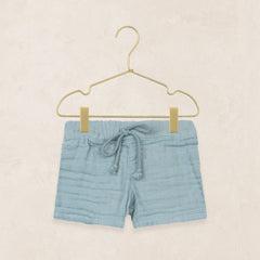 Lou Lou & Company Cloud Muslin Shorts in Steel, soft blue drawstring shorts on a hanger