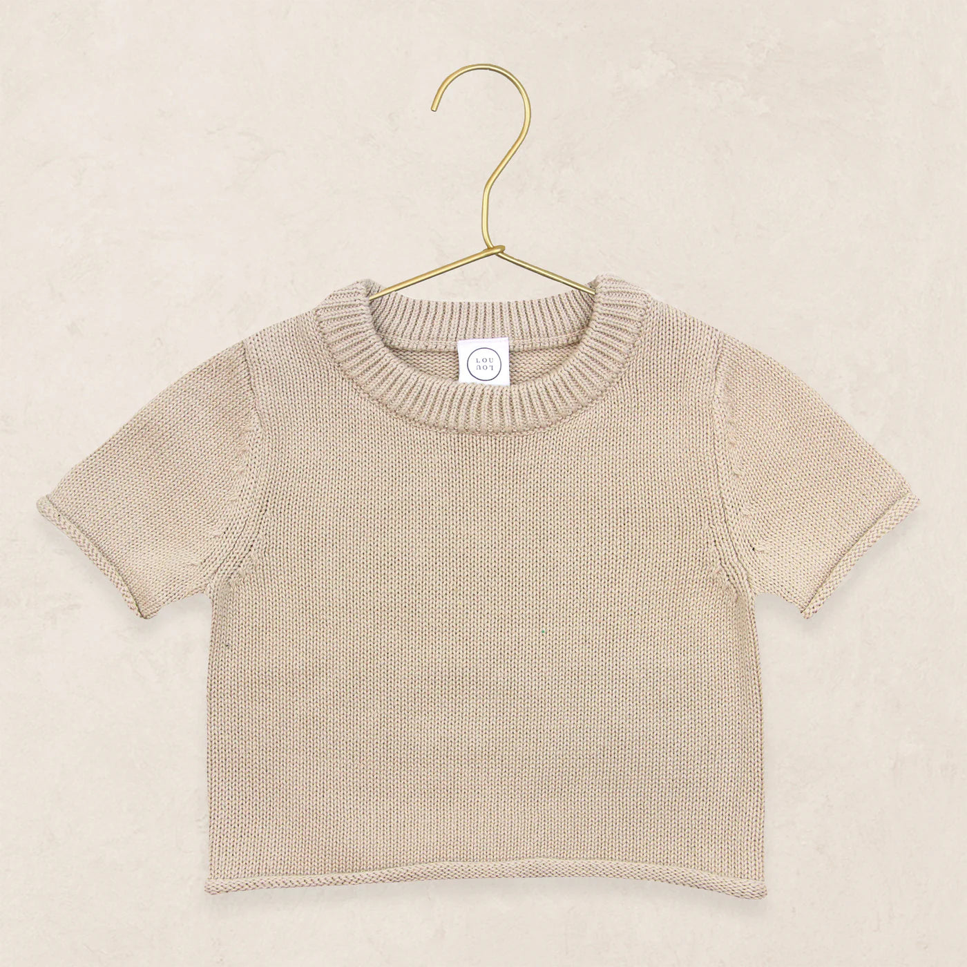 Lou Lou & Company Knit Short Sleeve Tee in Tan, a cotton knit baby tee on a hanger